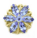 SLIDE W/ TANZANITE MQ IN A FLOWER DE