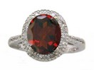 LDS OVAL GARNET AND DIAMOND RING